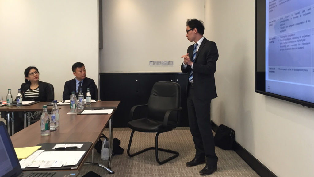 Hao Wang presenting to a Chinese delegation